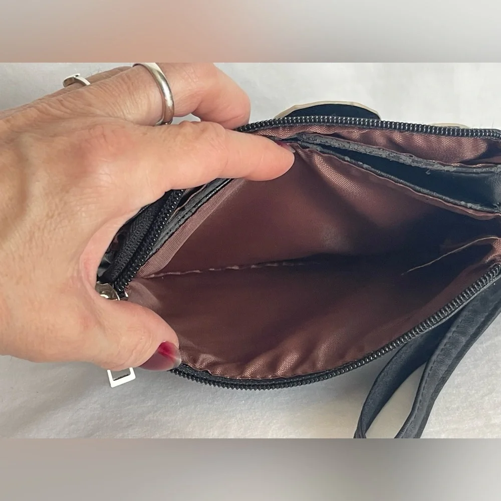 Fun little black faux, leather clutch wristlet three pocket with a zipper